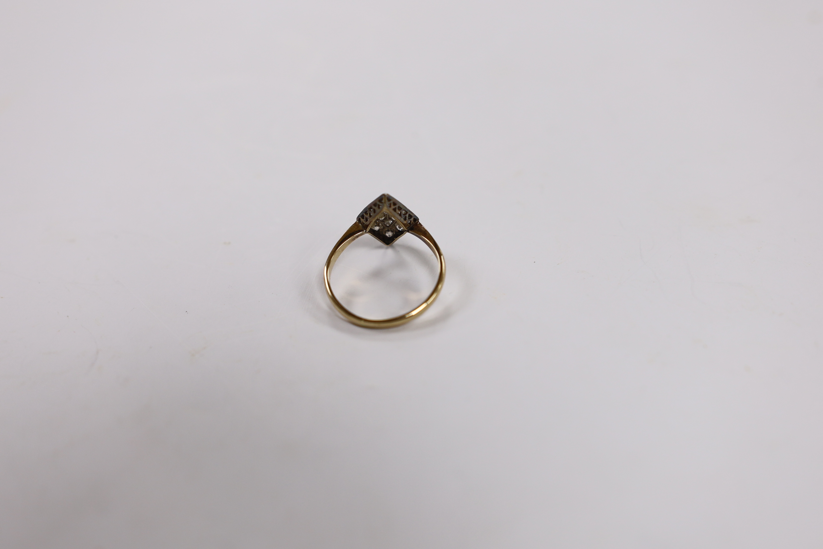 A late Victorian 18ct and diamond set diamond shaped cluster ring, size P, gross weight 2.7 grams.